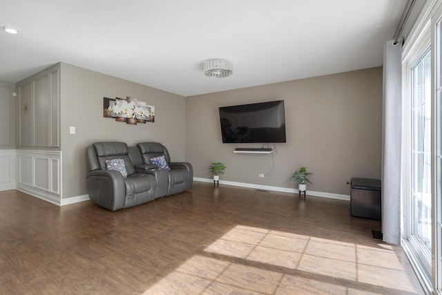 1850 Pierce Rd, Hoffman Estates, IL 60169 - living area featuring healthy amount of natural light, wood finished floors, and baseboards
