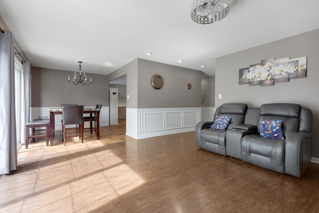 1850 Pierce Rd, Hoffman Estates, IL 60169 - living area with a chandelier, wood finished floors, a wainscoted wall, a decorative wall, and recessed lighting