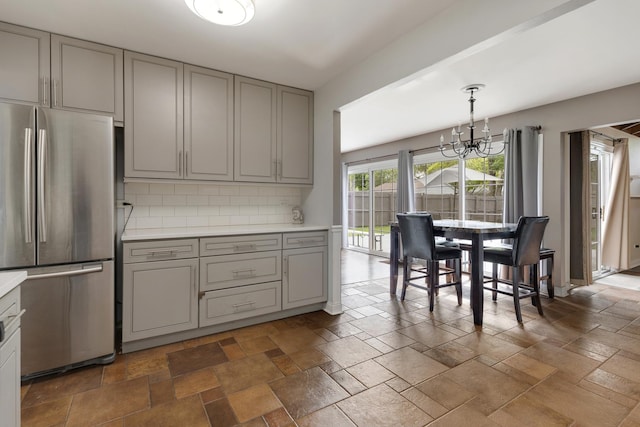 1850 Pierce Rd, Hoffman Estates, IL 60169 - kitchen featuring freestanding refrigerator, gray cabinets, a chandelier, and light countertops