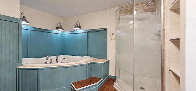 1 S Stanton St, Shannon, IL 61078 - bathroom with a shower stall, a garden tub, wood finished floors, and a decorative wall