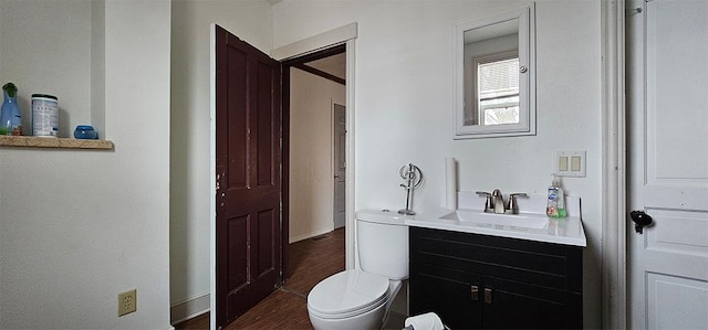 1 S Stanton St, Shannon, IL 61078 - half bath featuring vanity, toilet, wood finished floors, and baseboards