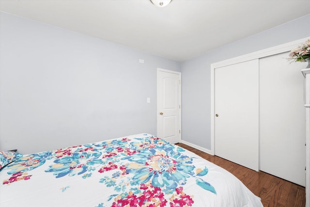 5642 W Dakin St, Chicago, IL 60634 - bedroom featuring wood finished floors, a closet, and baseboards