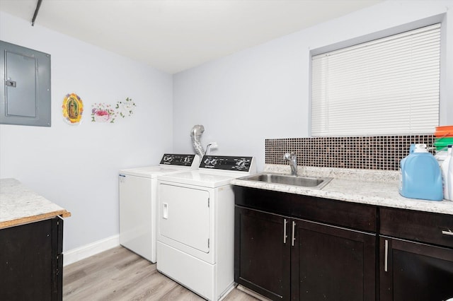 5642 W Dakin St, Chicago, IL 60634 - washroom featuring electric panel, separate washer and dryer, cabinet space, light wood-style floors, and baseboards