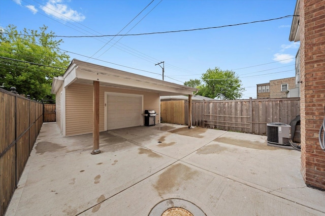 5642 W Dakin St, Chicago, IL 60634 - garage with central air condition unit, a garage, and driveway