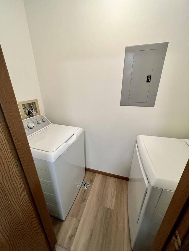 4400 W Shamrock Ln Unit 1B, Mchenry, IL 60050 - washroom with washer / clothes dryer, electric panel, wood finished floors, and baseboards