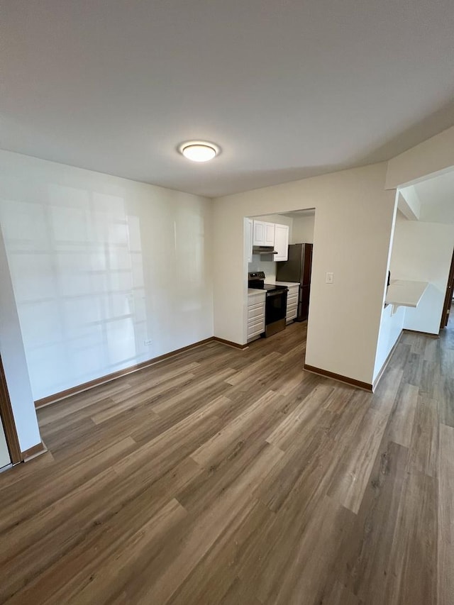 4400 W Shamrock Ln Unit 1B, Mchenry, IL 60050 - unfurnished room with dark wood-type flooring and baseboards