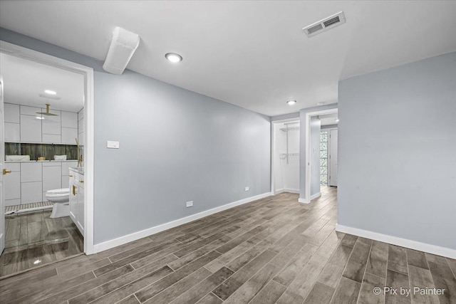 14028 S Wayman Ln, Robbins, IL 60472 - spare room with wood finished floors and recessed lighting