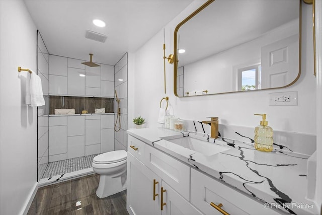 14028 S Wayman Ln, Robbins, IL 60472 - full bath featuring vanity, wood finished floors, a tile shower, and recessed lighting