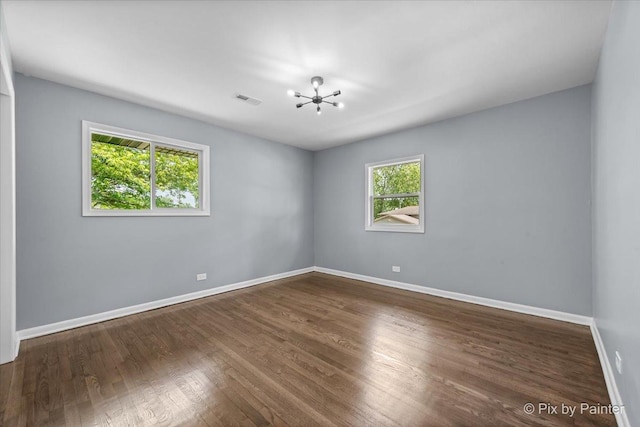 14028 S Wayman Ln, Robbins, IL 60472 - spare room with a chandelier and wood finished floors