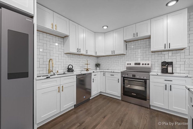 14028 S Wayman Ln, Robbins, IL 60472 - kitchen with appliances with stainless steel finishes, backsplash, white cabinetry, dark wood-style flooring, and recessed lighting