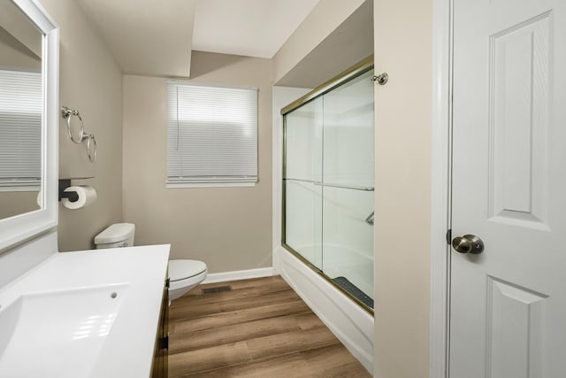 751 E 164th Pl, South Holland, IL 60473 - full bathroom with toilet, vanity, enclosed tub / shower combo, wood finished floors, and baseboards