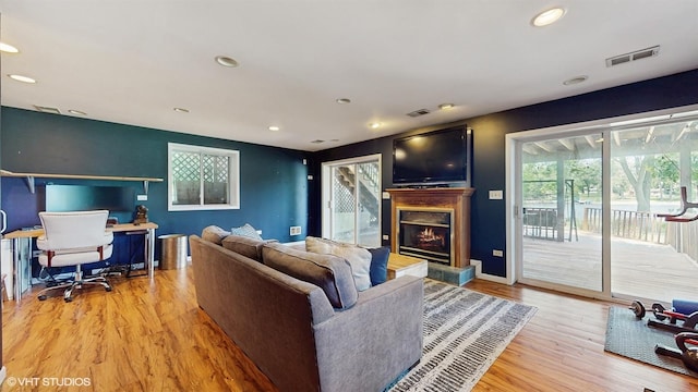 914 Ski Hill Rd, Fox River Grove, IL 60021 - living room featuring light wood-type flooring, a warm lit fireplace, recessed lighting, and an office area