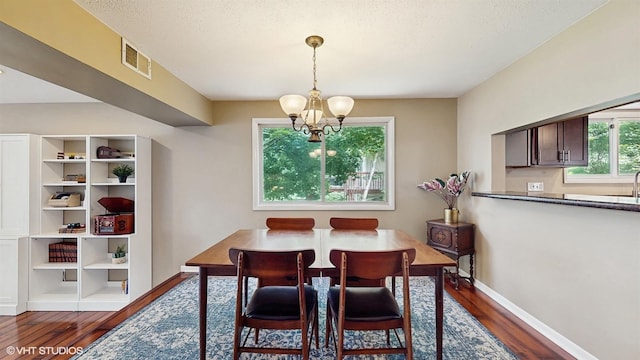 914 Ski Hill Rd, Fox River Grove, IL 60021 - dining room with a chandelier and dark wood finished floors