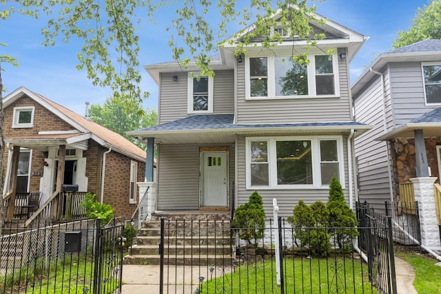 223 W 118th St, Chicago, IL 60628 - view of front facade with a fenced front yard and a gate