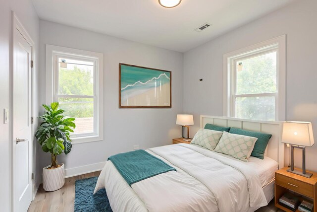 223 W 118th St, Chicago, IL 60628 - bedroom featuring wood finished floors and baseboards