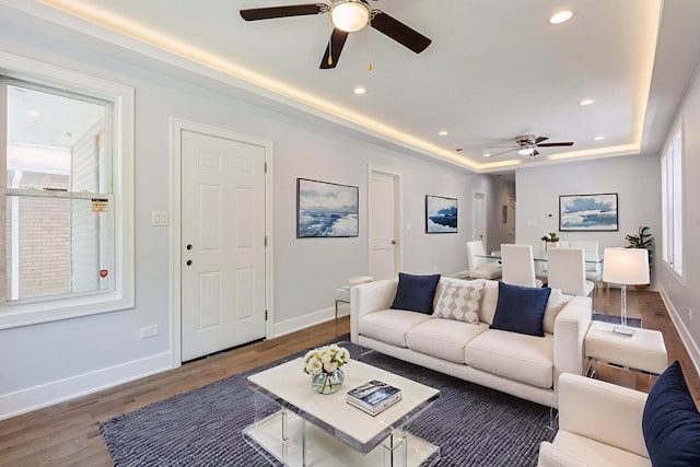 223 W 118th St, Chicago, IL 60628 - living area featuring ceiling fan, a tray ceiling, baseboards, and recessed lighting