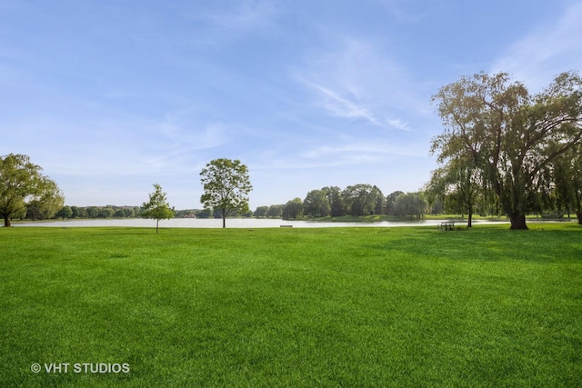 642 Burgundy Ct Unit A, Elk Grove Village, IL 60007 - view of grassy yard featuring a water view