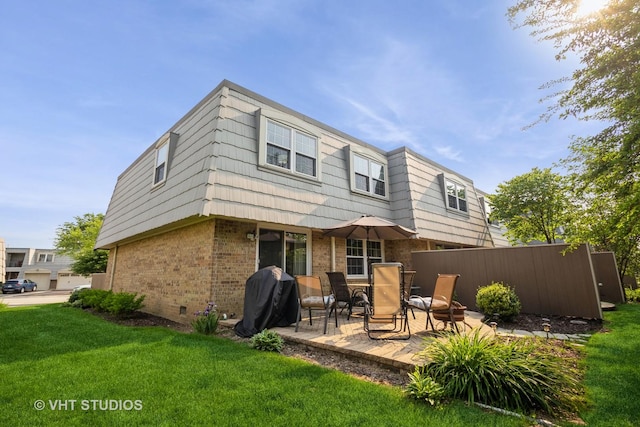 642 Burgundy Ct Unit A, Elk Grove Village, IL 60007 - back of house featuring brick siding and a patio
