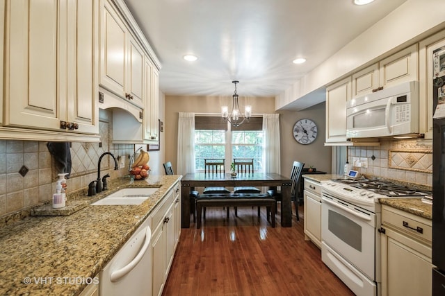 642 Burgundy Ct Unit A, Elk Grove Village, IL 60007 - kitchen featuring white appliances, cream cabinetry, a chandelier, tasteful backsplash, and recessed lighting