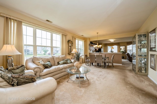 12140 Hideaway Dr, Huntley, IL 60142 - carpeted living room with a chandelier