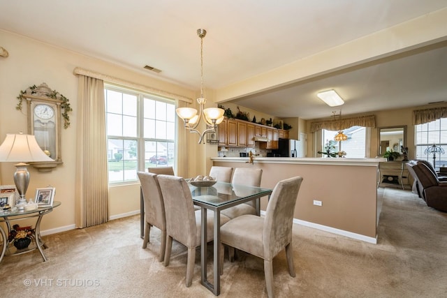 12140 Hideaway Dr, Huntley, IL 60142 - dining room with a chandelier and light colored carpet