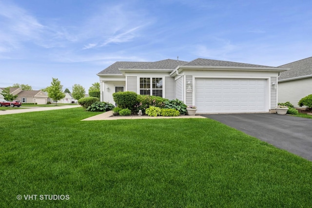 12140 Hideaway Dr, Huntley, IL 60142 - view of front of house with driveway, a front yard, a garage, and a shingled roof