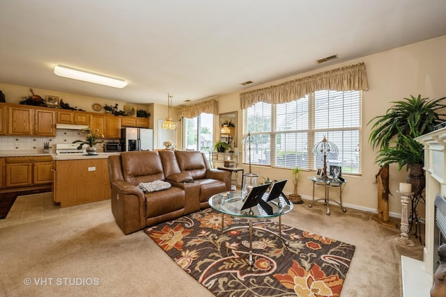 12140 Hideaway Dr, Huntley, IL 60142 - living area with light carpet and a fireplace