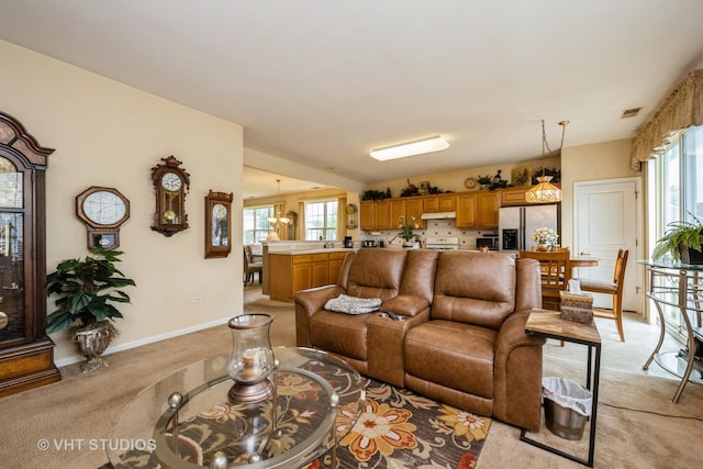 12140 Hideaway Dr, Huntley, IL 60142 - living area featuring light carpet and plenty of natural light