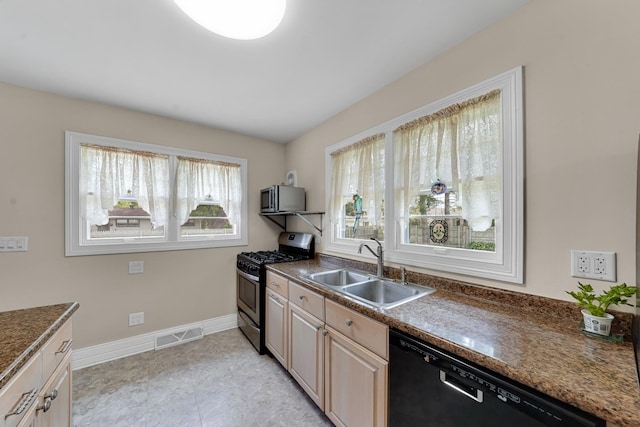 8819 Acorn Path, Wonder Lake, IL 60097 - kitchen with dishwasher, gas stove, a sink, dark countertops, and baseboards