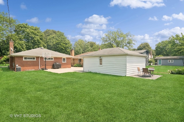 530 S Mitchell Ave, Arlington Heights, IL 60005 - back of property featuring a patio area, a chimney, a yard, and brick siding