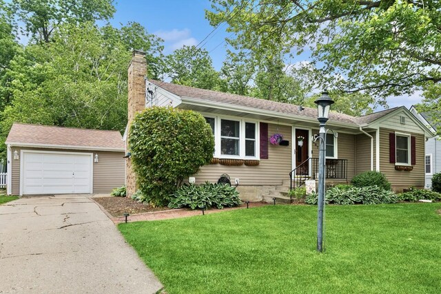207 S Van Buren St, East Dundee, IL 60118 - view of front of house with a chimney, a front yard, a garage, and driveway