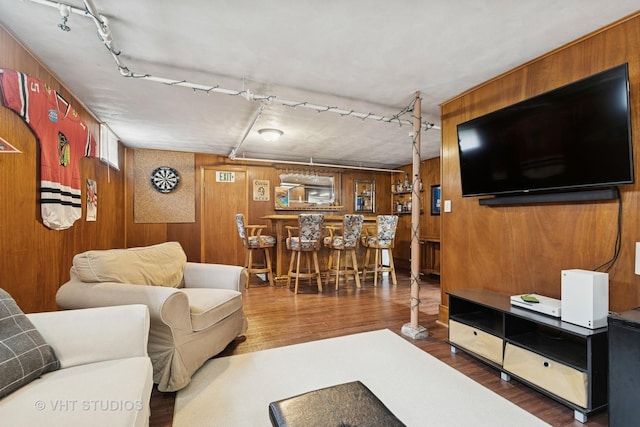 207 S Van Buren St, East Dundee, IL 60118 - living area with track lighting, bar area, wooden walls, and wood finished floors