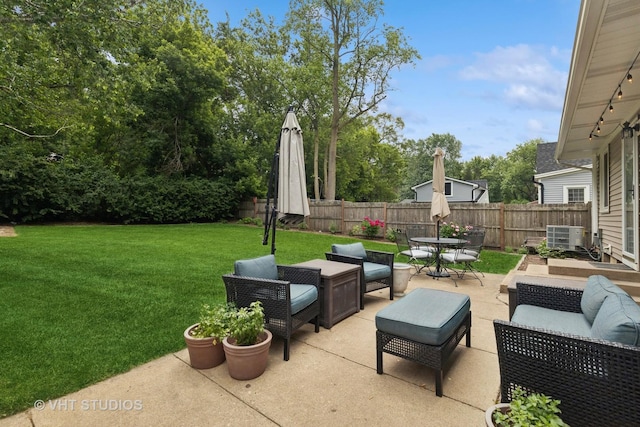 207 S Van Buren St, East Dundee, IL 60118 - fenced backyard with an outdoor hangout area, a patio area, and outdoor dining space