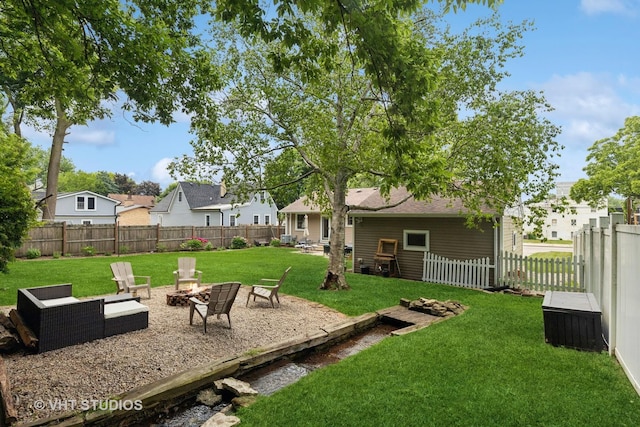 207 S Van Buren St, East Dundee, IL 60118 - fenced backyard featuring an outdoor fire pit and a residential view