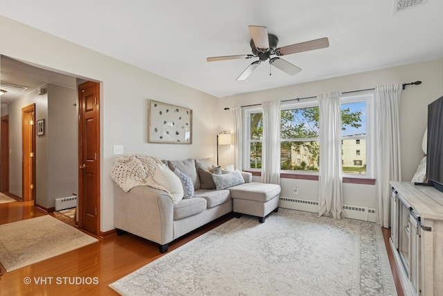 207 S Van Buren St, East Dundee, IL 60118 - living area featuring a ceiling fan, baseboard heating, and wood finished floors