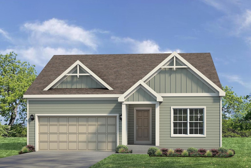 347 N Aspen Dr, Cortland, IL 60112 - view of front of home featuring roof with shingles, board and batten siding, driveway, and a front yard