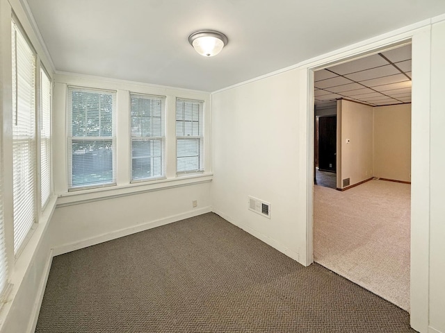 111 E Roosevelt St, Freeport, IL 61032 - spare room with dark carpet, healthy amount of natural light, and baseboards