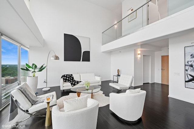1720 Maple Ave Unit 2710, Evanston, IL 60201 - living area with dark wood-style flooring and a towering ceiling