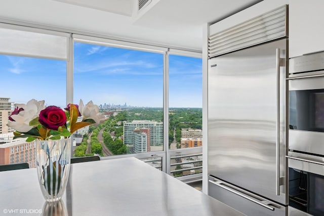 1720 Maple Ave Unit 2710, Evanston, IL 60201 - kitchen with appliances with stainless steel finishes, a city view, and white cabinetry