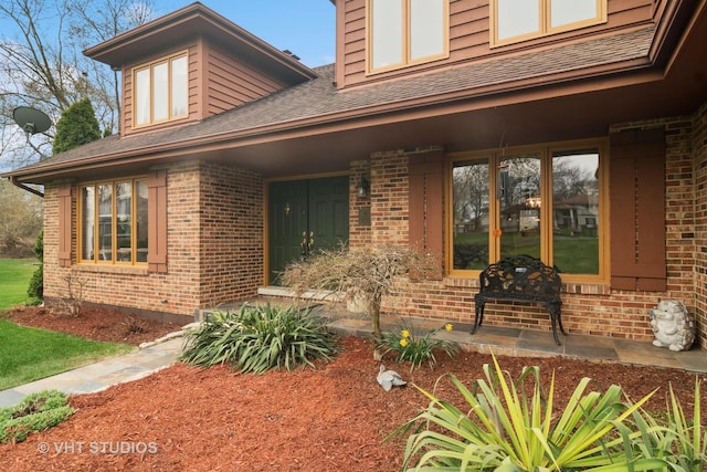 1422 Kirkwall Ct, Inverness, IL 60010 - view of exterior entry featuring brick siding and a shingled roof