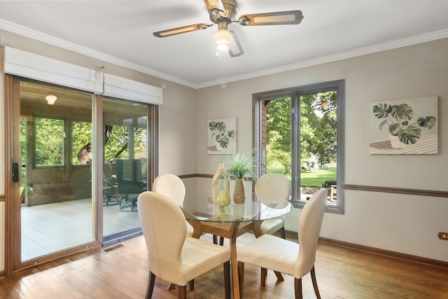 1422 Kirkwall Ct, Inverness, IL 60010 - dining area featuring healthy amount of natural light, light wood-style floors, crown molding, and baseboards