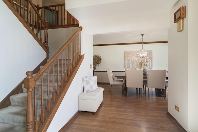 1422 Kirkwall Ct, Inverness, IL 60010 - staircase featuring wood finished floors, a chandelier, and baseboards