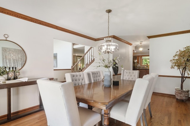 1422 Kirkwall Ct, Inverness, IL 60010 - dining room featuring a chandelier, stairway, baseboards, wood finished floors, and crown molding