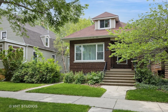 1019 Lyman Ave, Oak Park, IL 60304 - view of front facade featuring brick siding and a front yard