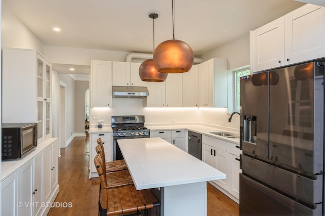 1019 Lyman Ave, Oak Park, IL 60304 - kitchen with stainless steel fridge with ice dispenser, under cabinet range hood, black microwave, range with gas cooktop, and dishwasher