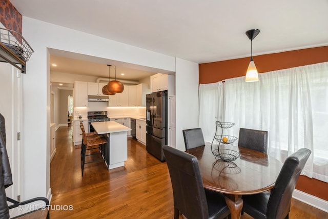 1019 Lyman Ave, Oak Park, IL 60304 - dining room with dark wood-style flooring and recessed lighting