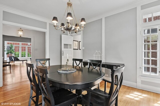739 Jackson Ave, River Forest, IL 60305 - dining room featuring crown molding, a chandelier, and light wood-style flooring