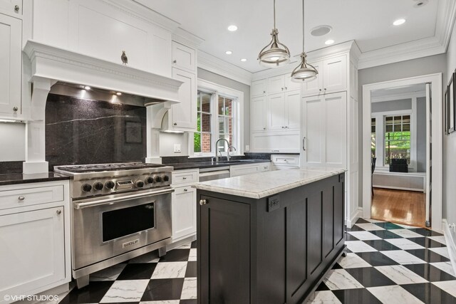 739 Jackson Ave, River Forest, IL 60305 - kitchen with stainless steel appliances, plenty of natural light, white cabinetry, recessed lighting, and ornamental molding