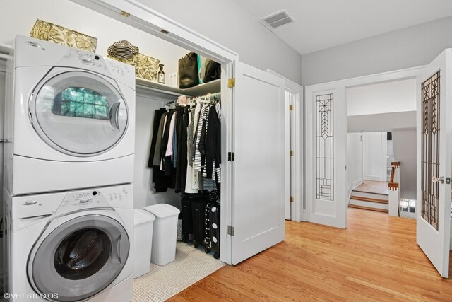 739 Jackson Ave, River Forest, IL 60305 - laundry area featuring stacked washer / drying machine and light wood-style flooring