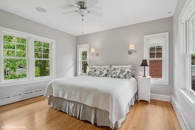 739 Jackson Ave, River Forest, IL 60305 - bedroom with a baseboard radiator, light wood-type flooring, and a ceiling fan